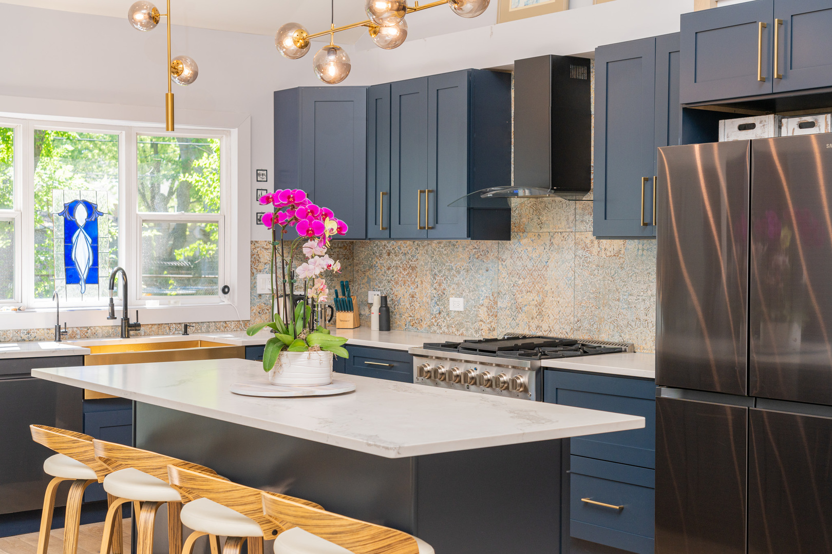 20665 North Weiland Road Lincolnshire, IL 60069 - Photo 4 of 32 a kitchen with stainless steel appliances granite countertop a refrigerator and a stove