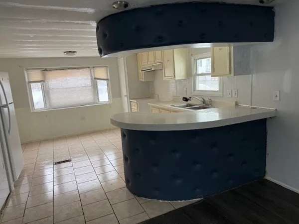 a bathroom with a sink a toilet and mirror