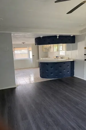 a view of room and wooden floor