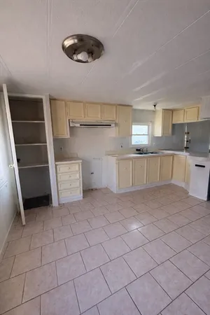 a view of a kitchen with a sink