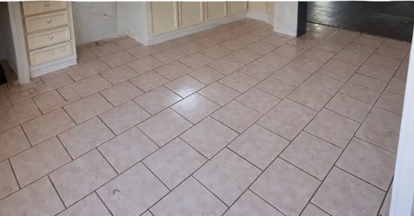 a view of a livingroom with wooden floor and a fireplace