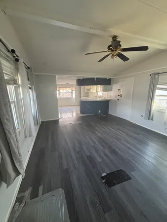 a bedroom with a bed next to a window