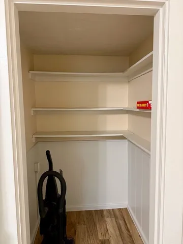 a bathroom with a toilet sink vanity and mirror