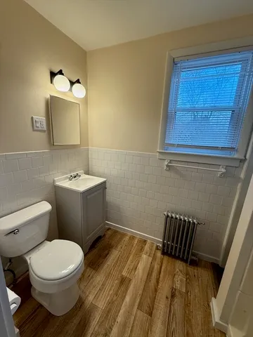 a bathroom with a shower and a sink