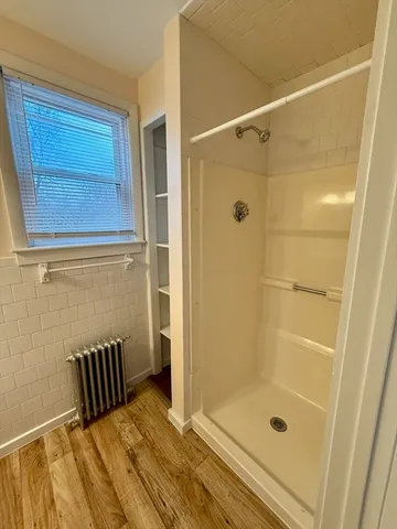 a view of hallway with wooden floor