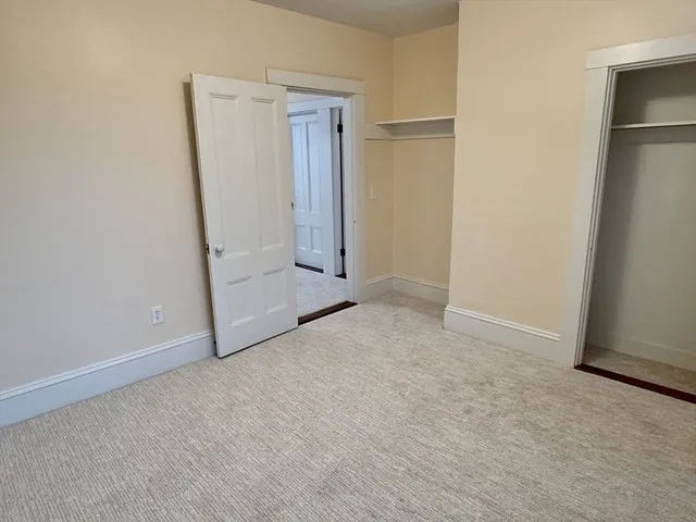 a kitchen with granite countertop a sink stove and cabinets