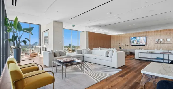 a living room with furniture or couch and a wooden floor