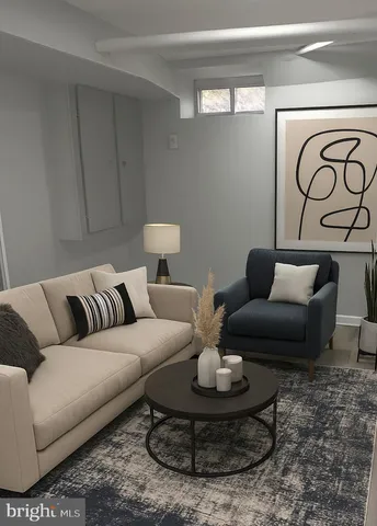 a living room with furniture and a rug