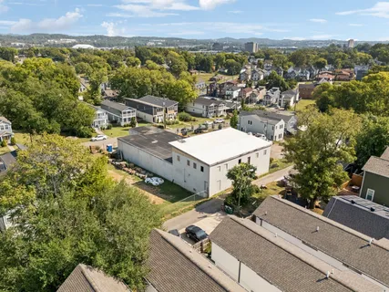 an aerial view of a house with a garden