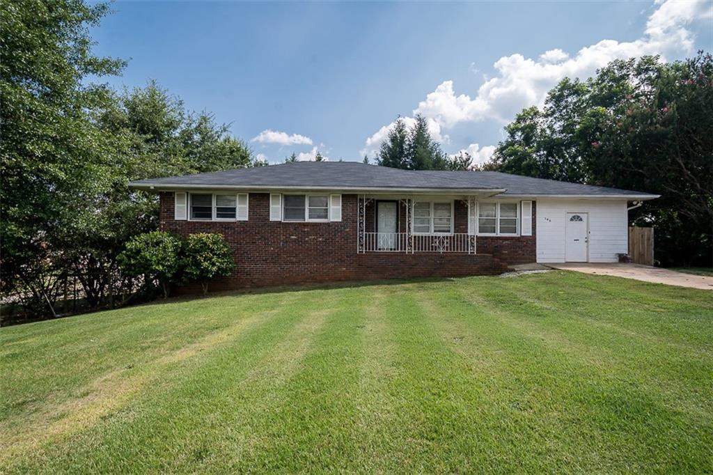 a front view of house with yard and green space