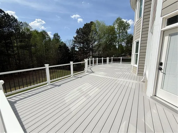 a bathroom with a bathtub a double vanity sink and mirror