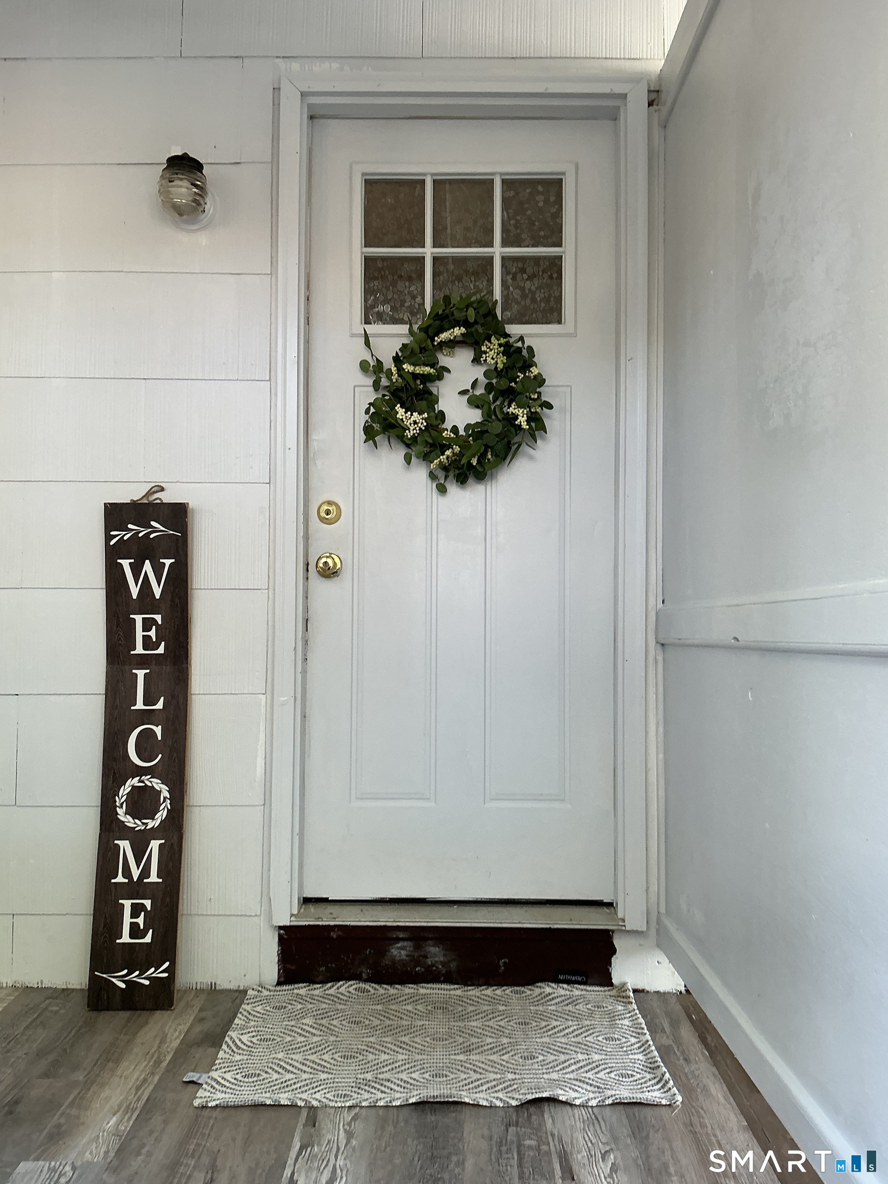 a view of a door and a window