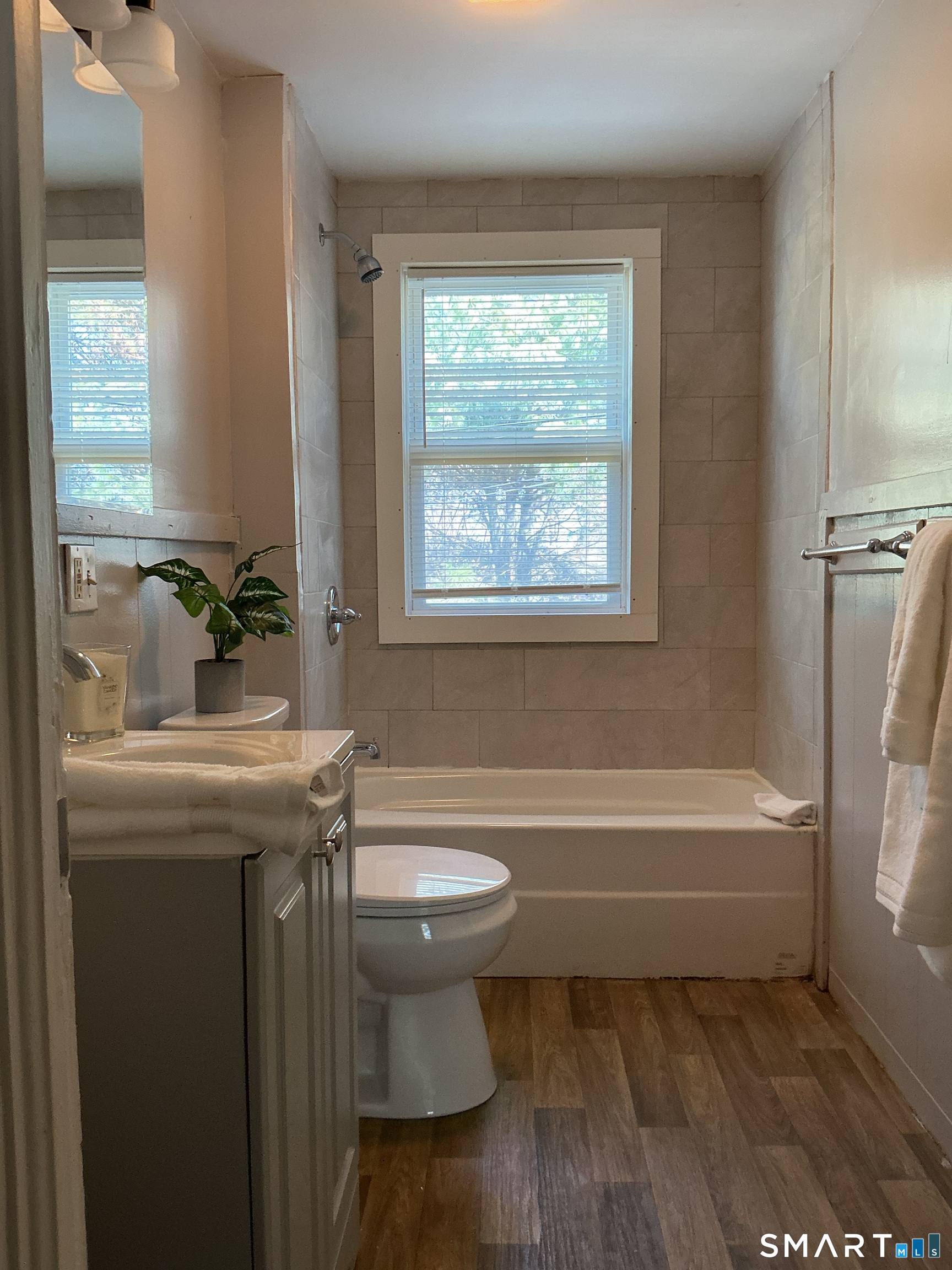 8 Rogers Place Manchester, CT 06040 - Photo 11 of 16 a bathroom with a sink a toilet and bathtub