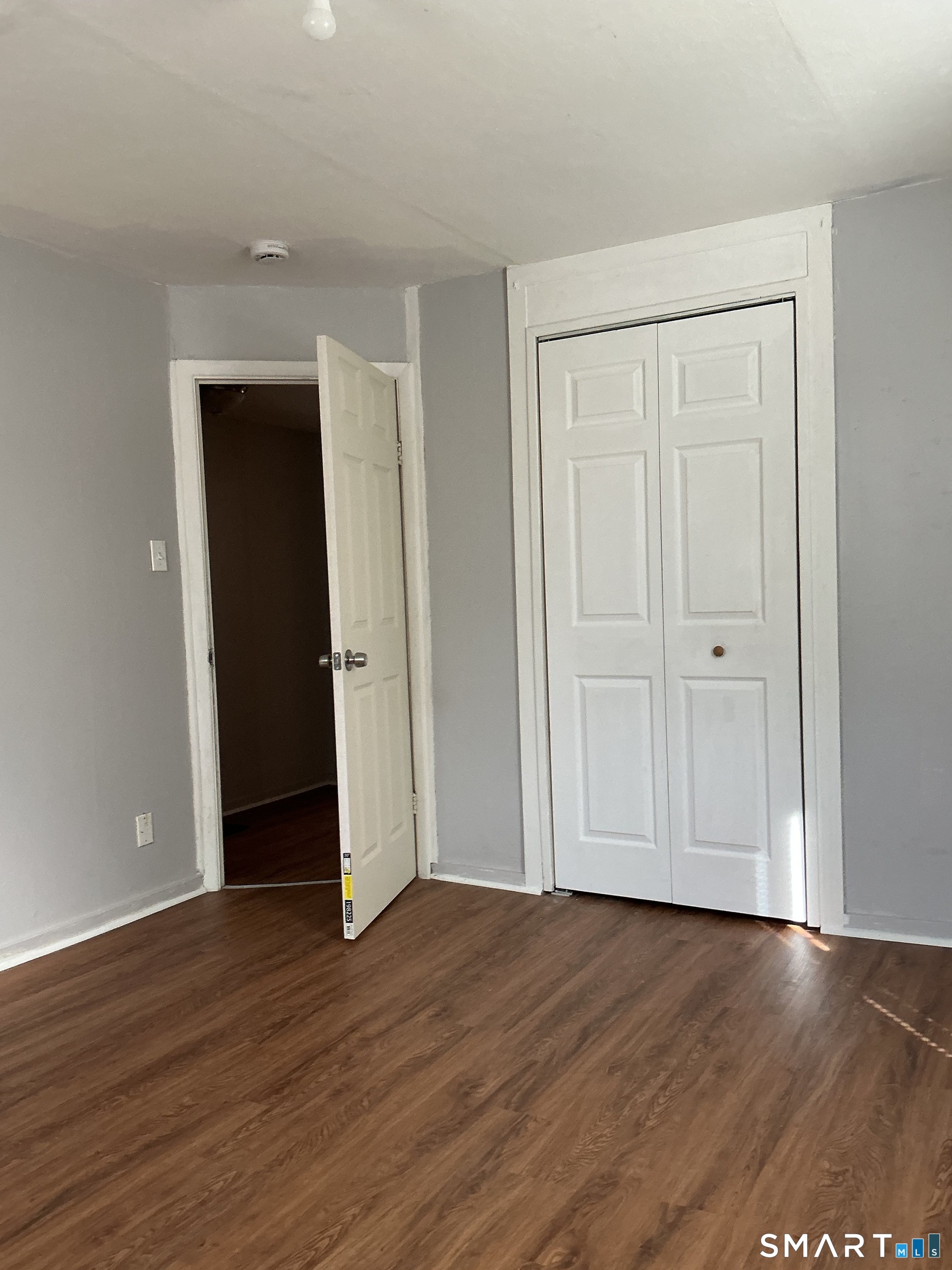 8 Rogers Place Manchester, CT 06040 - Photo 15 of 16 a view of an empty room with wooden floor