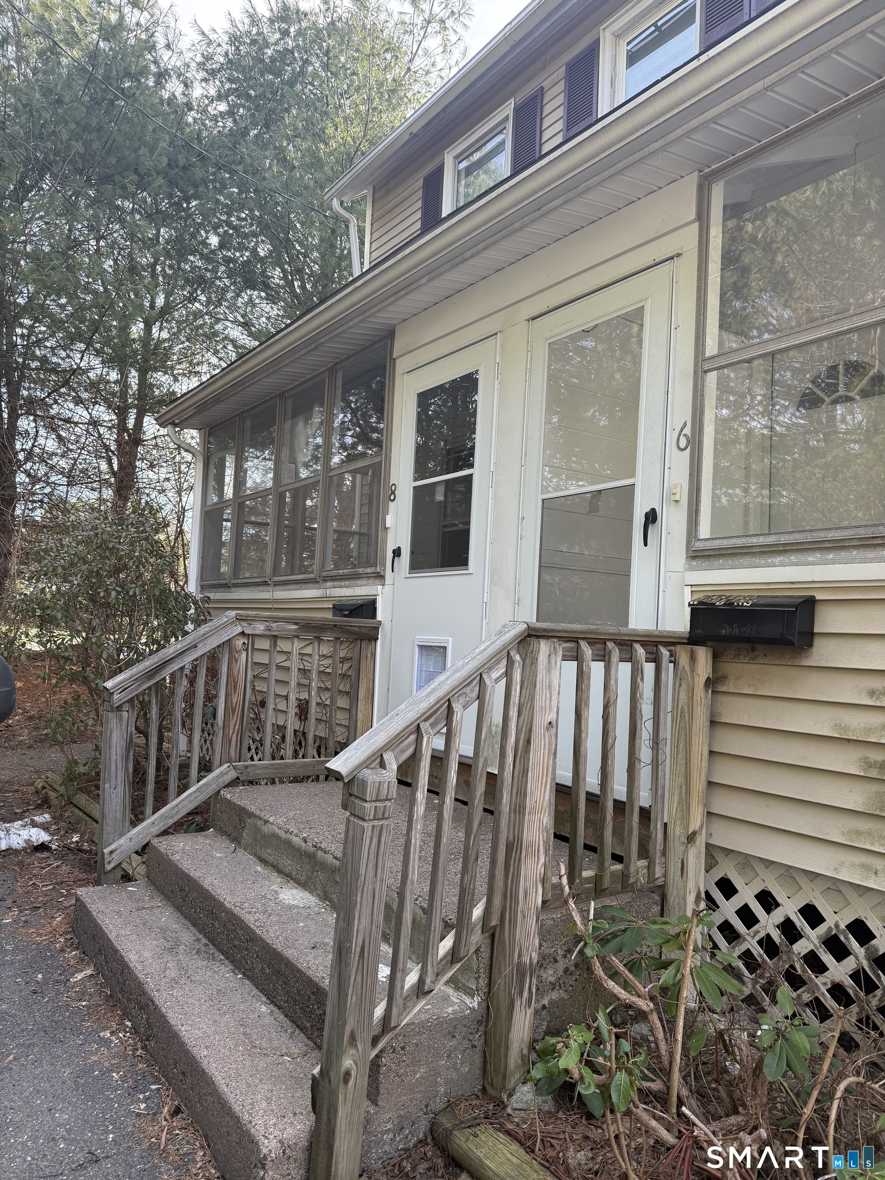 8 Rogers Place Manchester, CT 06040 - Photo 4 of 16 a view of a house with wooden fence and two windows
