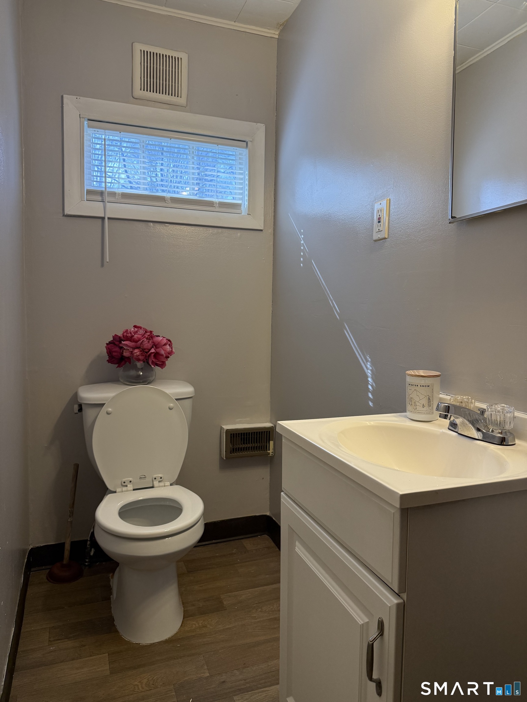 8 Rogers Place Manchester, CT 06040 - Photo 8 of 16 a white toilet sitting next to a bathroom sink