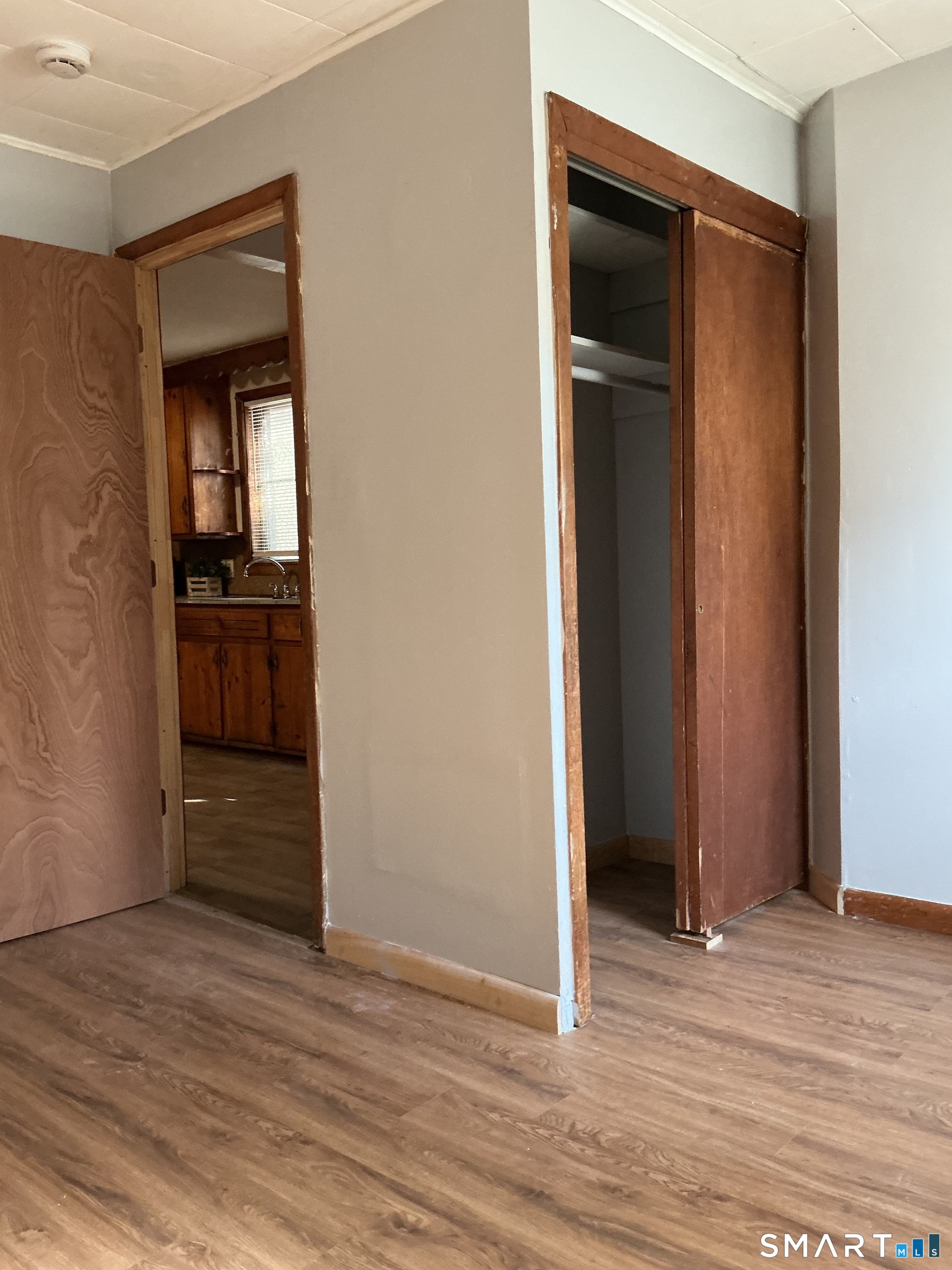 8 Rogers Place Manchester, CT 06040 - Photo 9 of 16 an empty room with wooden floor and closet