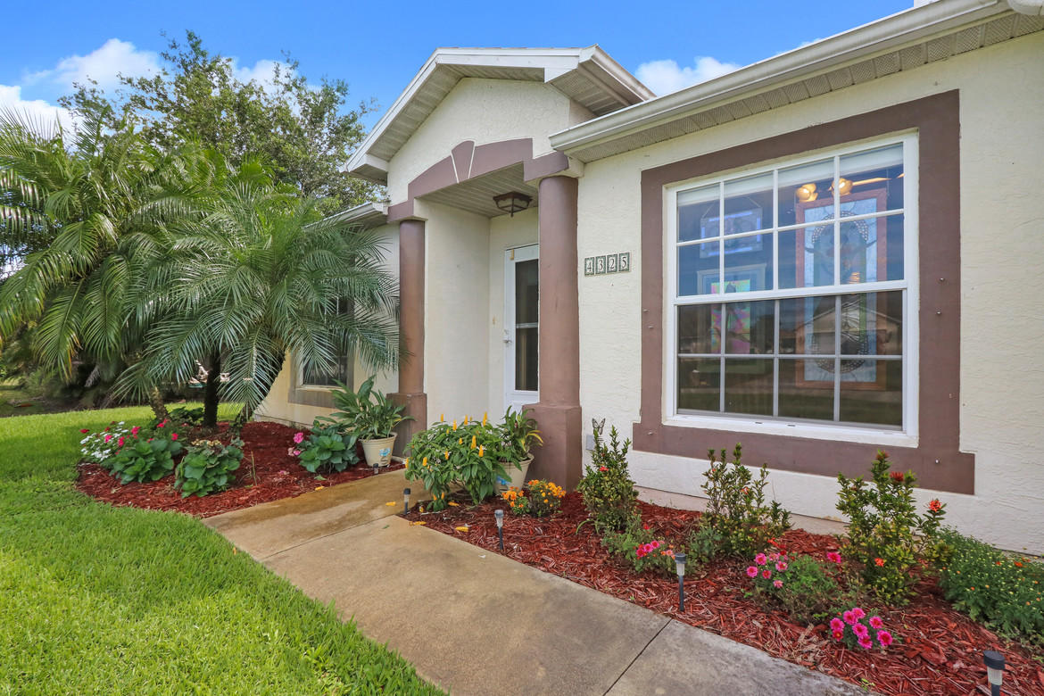 4325 Southwest Appleseed Road Port St. Lucie, FL 34953 - Photo 2 of 17 Appleseed front walkway