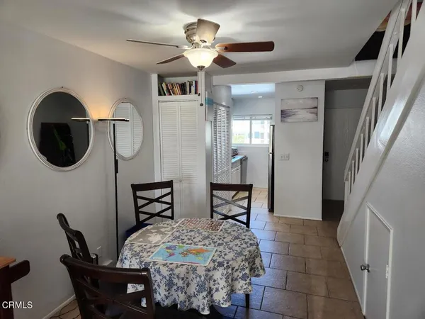 a dining room with furniture and window