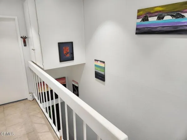 a view of a hallway with staircase