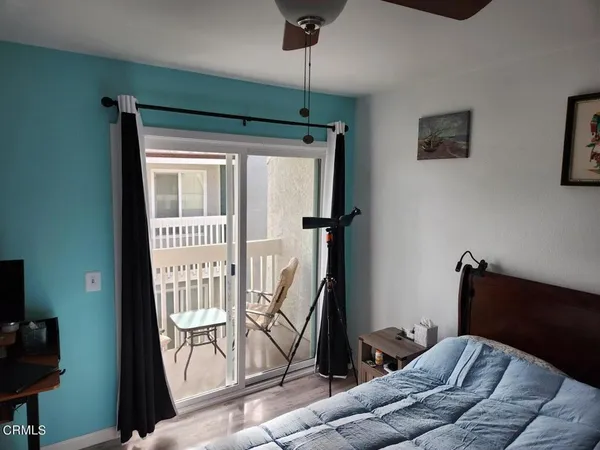 a bedroom with furniture and a window
