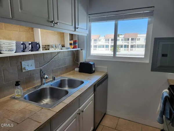 a kitchen with a sink and a window