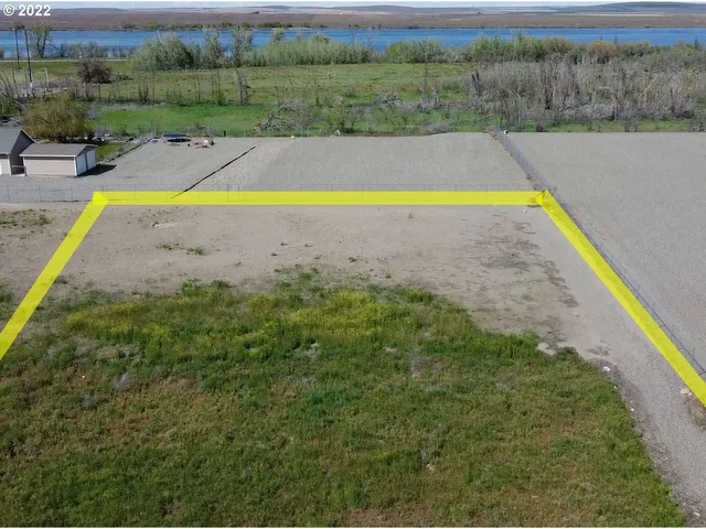 an aerial view of a house with a swimming pool