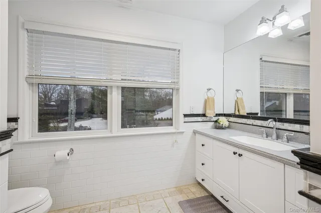 a room with furniture pool table and flat screen tv