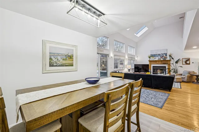 a living room with furniture fireplace and flat screen tv