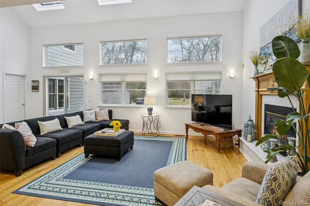 a view of a living room and kitchen with furniture