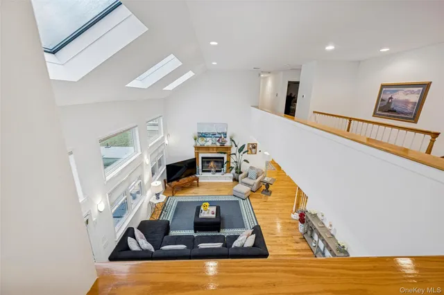 a bedroom with a bed and glass walk in closet