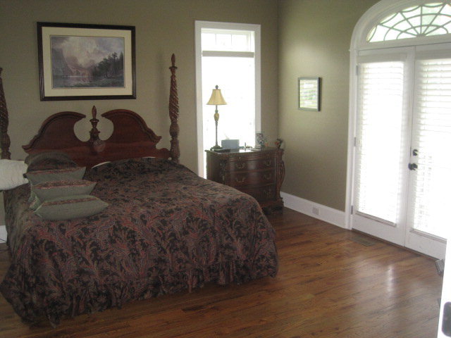 9185 Estes Road Macon, GA 31220 - Photo 14 of 20 a bedroom with a bed and wooden floor