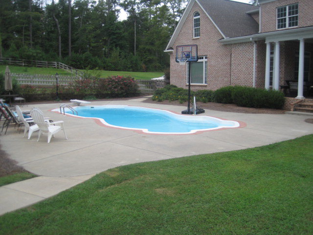 9185 Estes Road Macon, GA 31220 - Photo 15 of 20 a front view of a house with a yard and garage