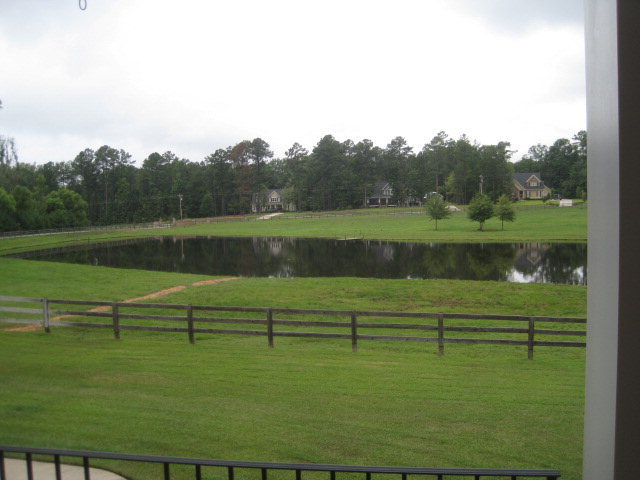 9185 Estes Road Macon, GA 31220 - Photo 17 of 20 a view of a lake with a yard