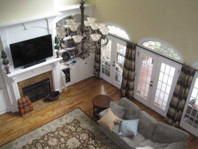 9185 Estes Road Macon, GA 31220 - Photo 3 of 20 a living room with furniture a flat screen tv and a fireplace