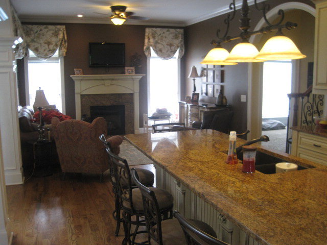 9185 Estes Road Macon, GA 31220 - Photo 6 of 20 a kitchen with a table chairs and a fireplace