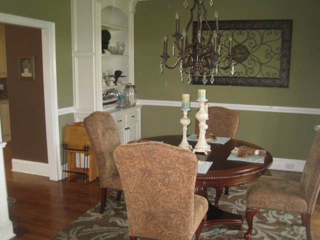 9185 Estes Road Macon, GA 31220 - Photo 9 of 20 a view of a dining room with furniture and wooden floor