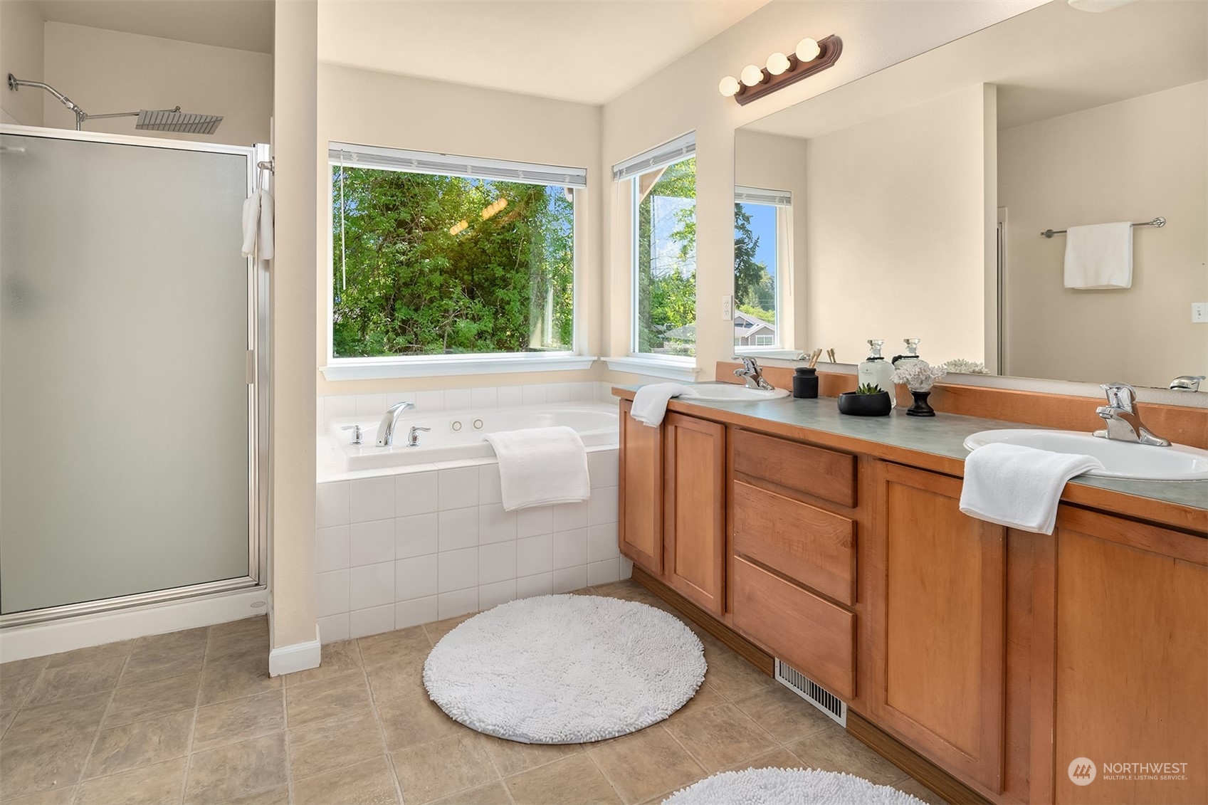 2017 Northeast 27th Street Renton, WA 98056 - Photo 18 of 27 a bathroom with a sink toilet and large mirror
