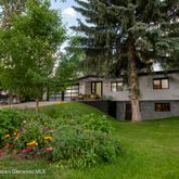 a view of a house with a yard porch and sitting area