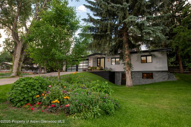 a view of a house with a yard porch and sitting area