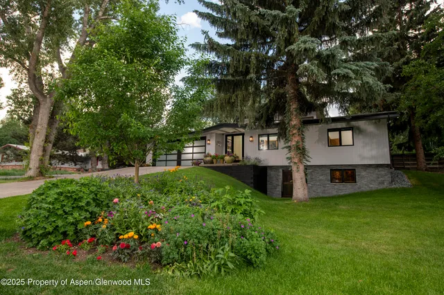 a view of a house with a yard porch and sitting area