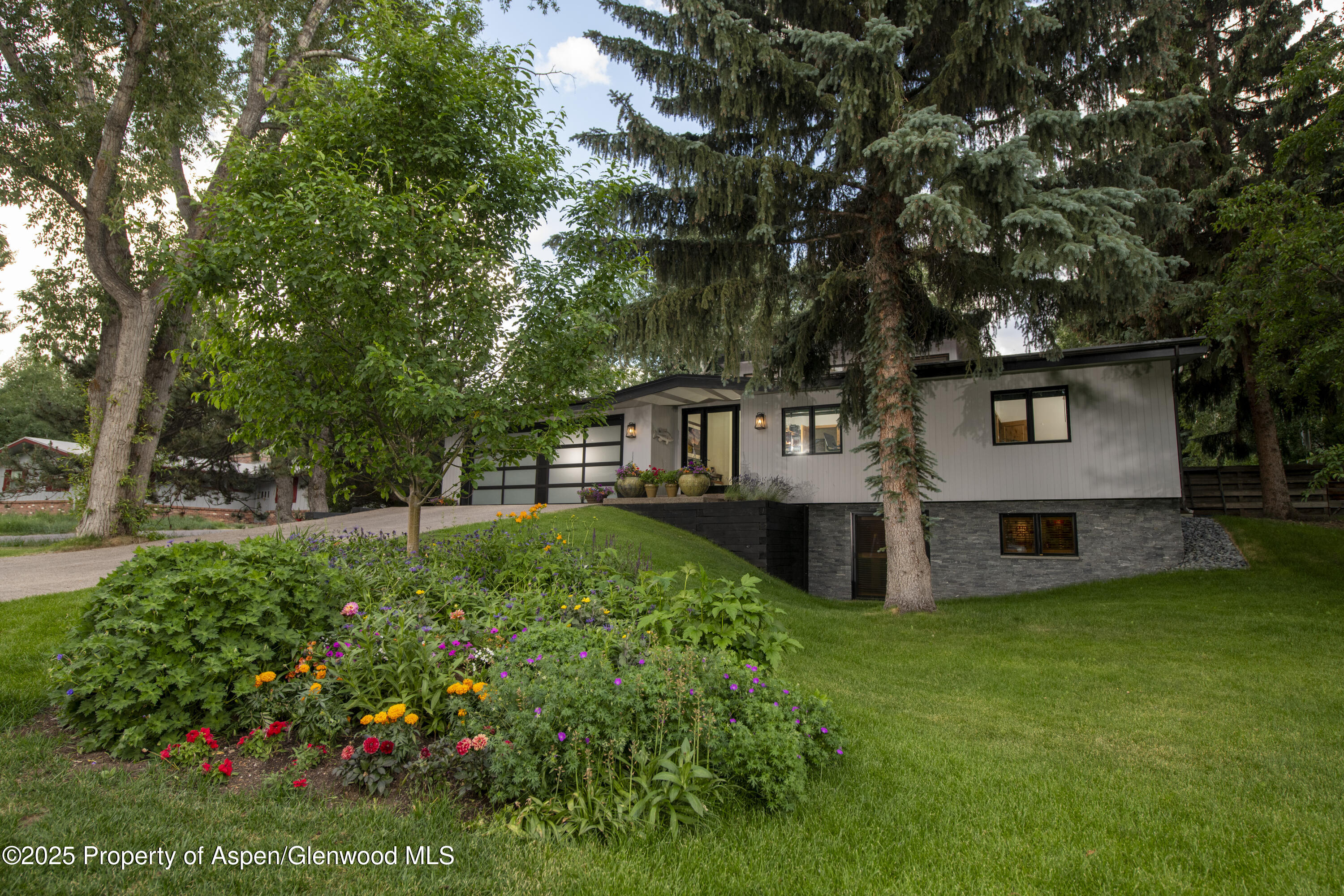 a view of a house with a yard porch and sitting area