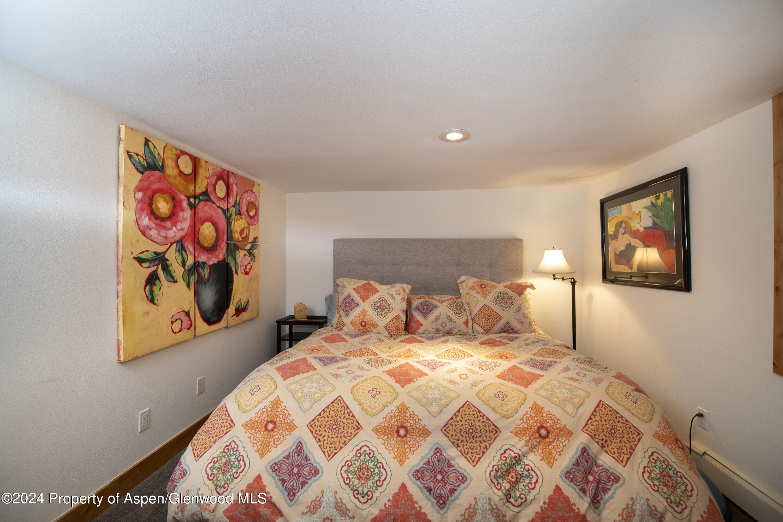 1325 Mountain View Drive Aspen, CO 81611 - Photo 17 of 26 a bedroom with a bed and painting on the wall