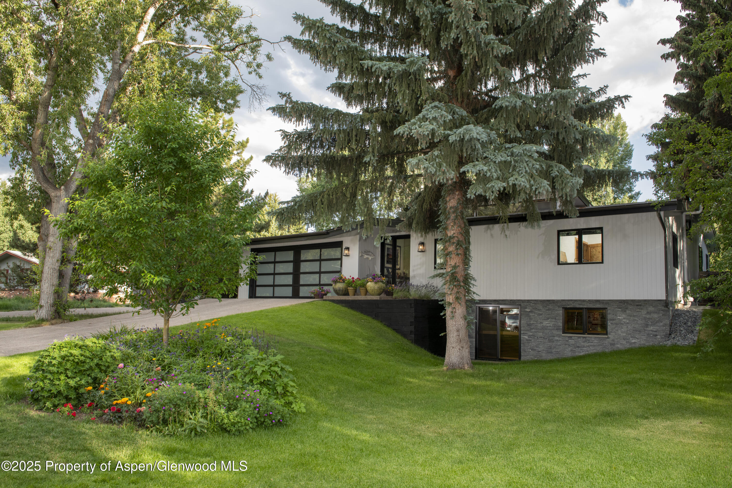 1325 Mountain View Drive Aspen, CO 81611 - Photo 2 of 26 a view of a house with a yard