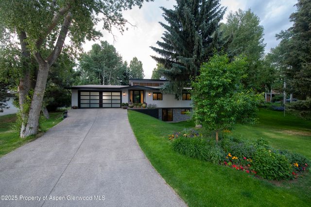 a view of house with outdoor space and yard