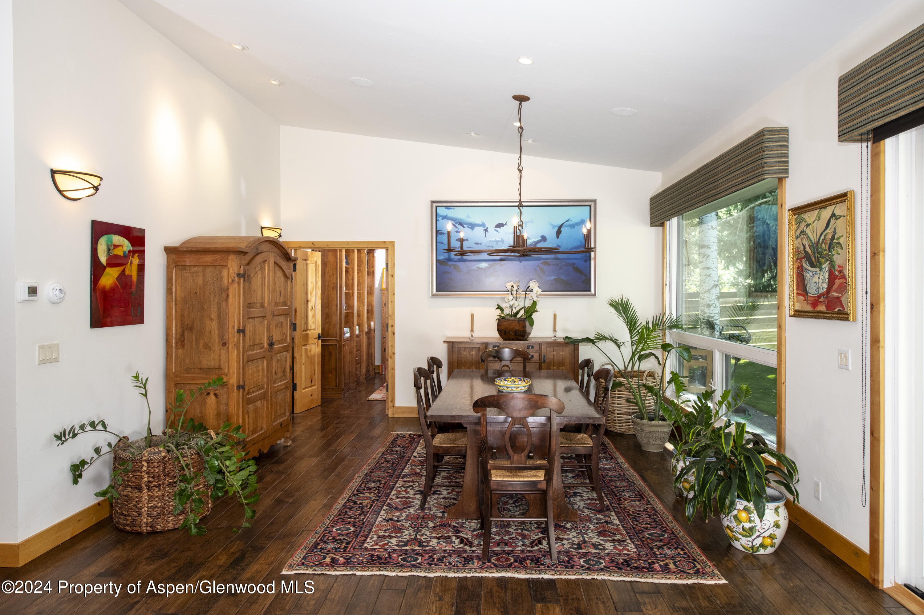 1325 Mountain View Drive Aspen, CO 81611 - Photo 6 of 26 a view of a dining room with furniture window and wooden floor