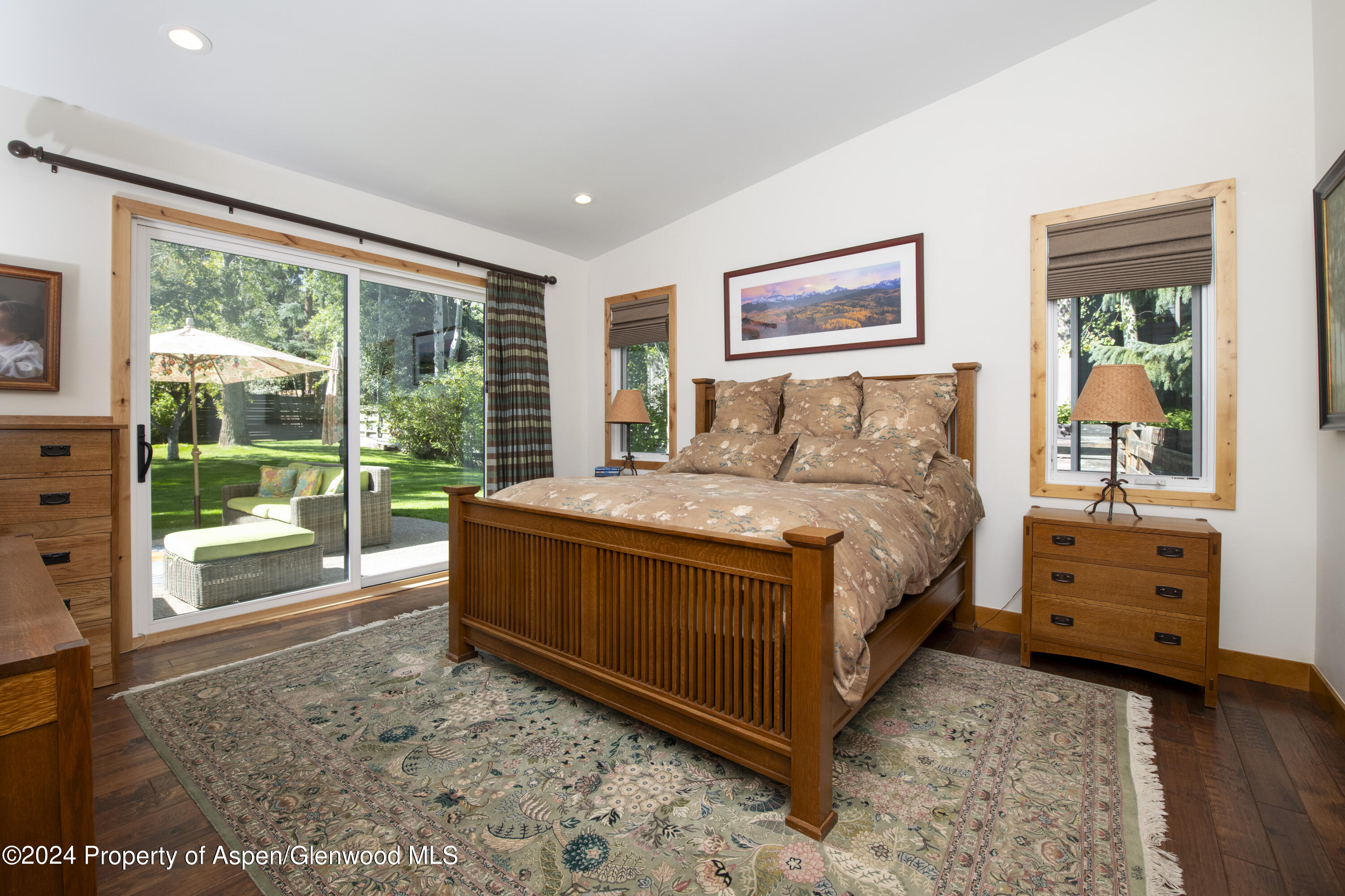 1325 Mountain View Drive Aspen, CO 81611 - Photo 8 of 26 a bed sitting in a spacious bedroom next to a window