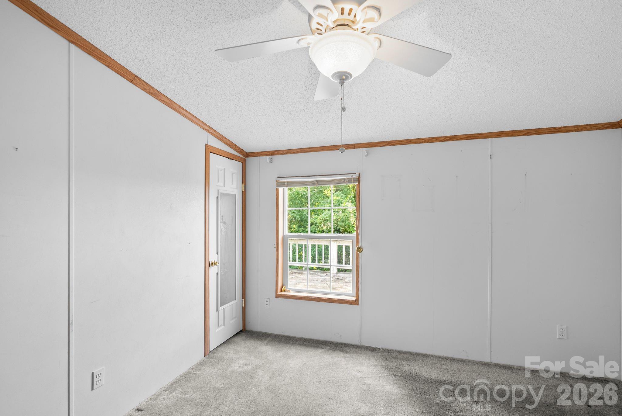 133 Spivey Mountain Road Asheville, NC 28806 - Photo 21 of 40 a view of an empty room with a window