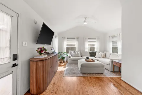 a living room with furniture and a flat screen tv