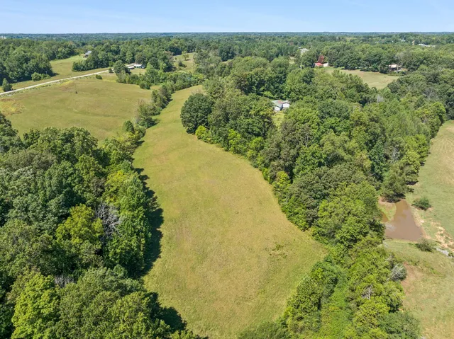 a view of a field with an outdoor space